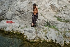   آب‌تنی در چشمه علی